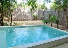 Doomos. Super oportunidad en la Veleta in Tulum Depa en planta baja con patio y piscina privada.